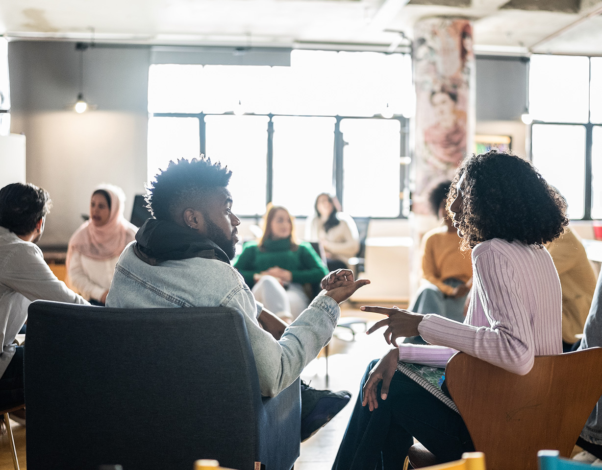 Image of man and woman talking to each other